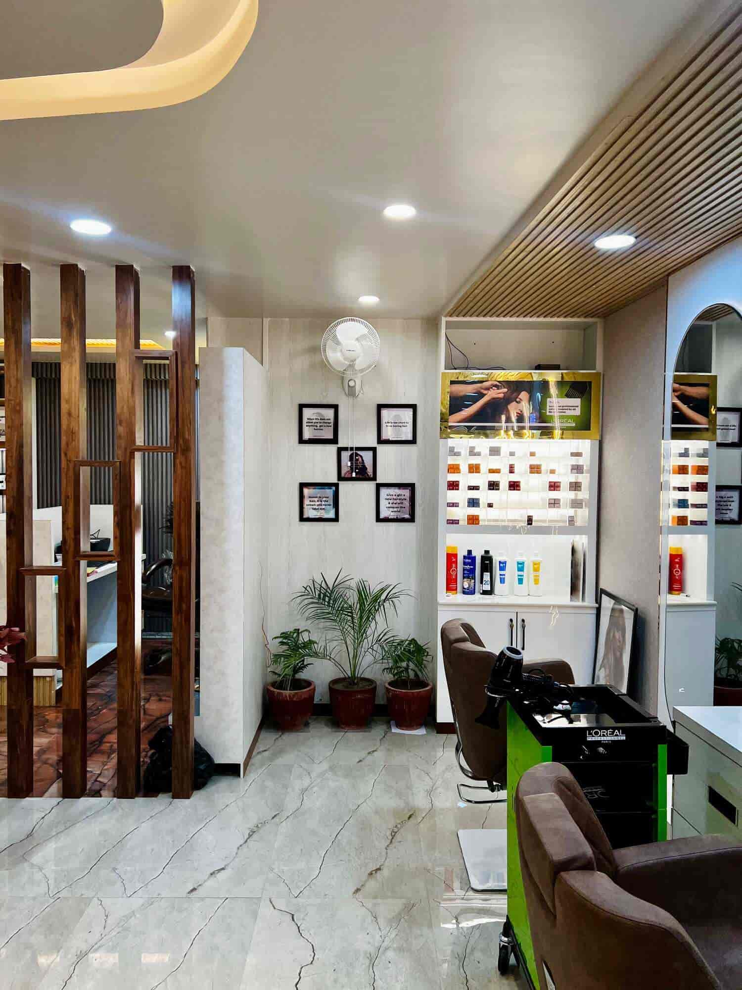 Hair station — L'Oréal color swatches, wooden partition, marble floor