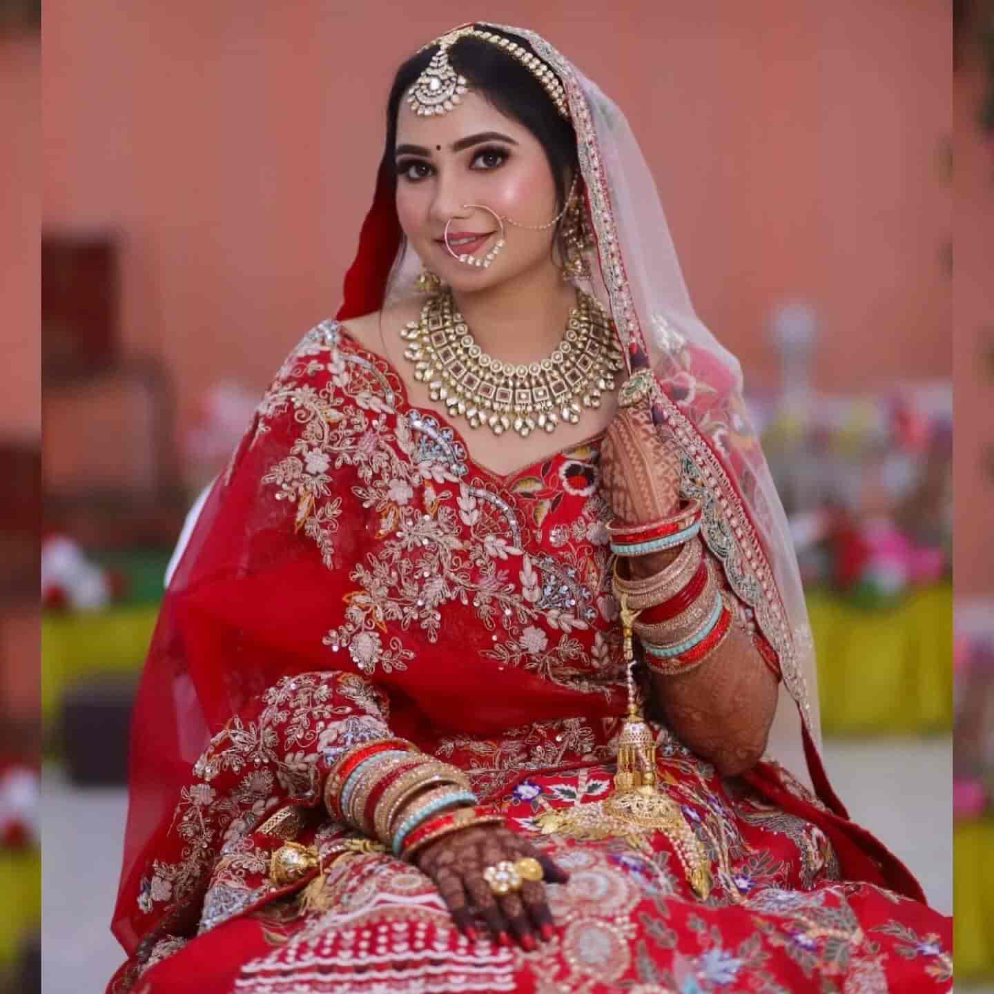 Bridal makeup by Barça10 — bride in red lehenga with kundan jewelry